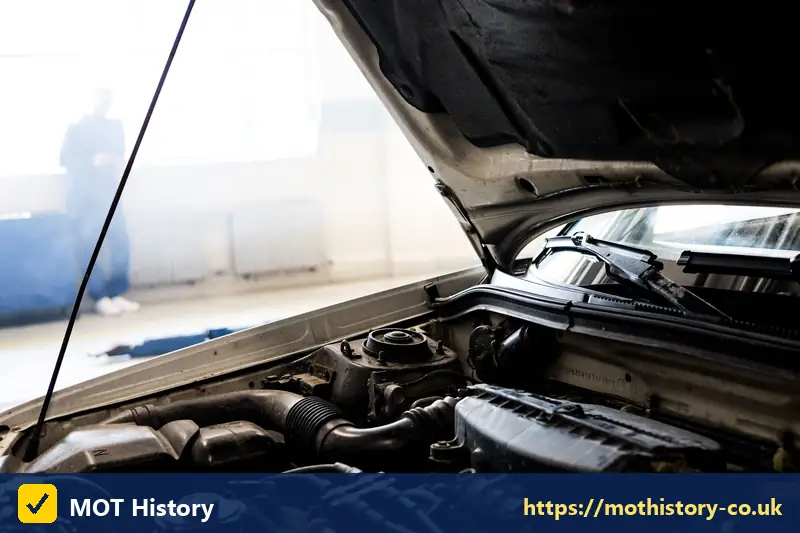 Engine bay seen from the front of a car with the bonnet open - assigning vehicle registration