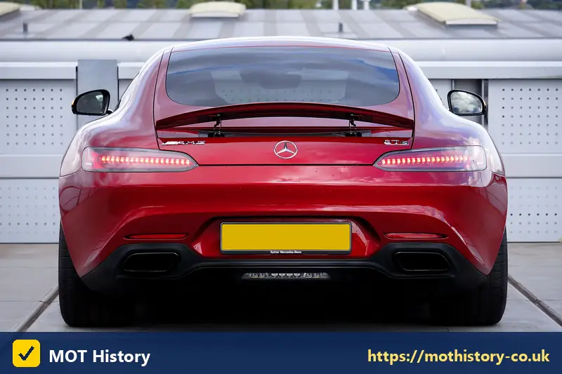 Rear of a red sports car with a yellow number plate - dvla ireland number plates