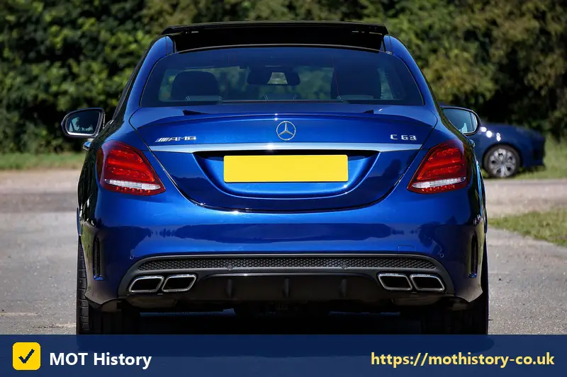 Rear of a blue saloon with a yellow number plate - value my reg